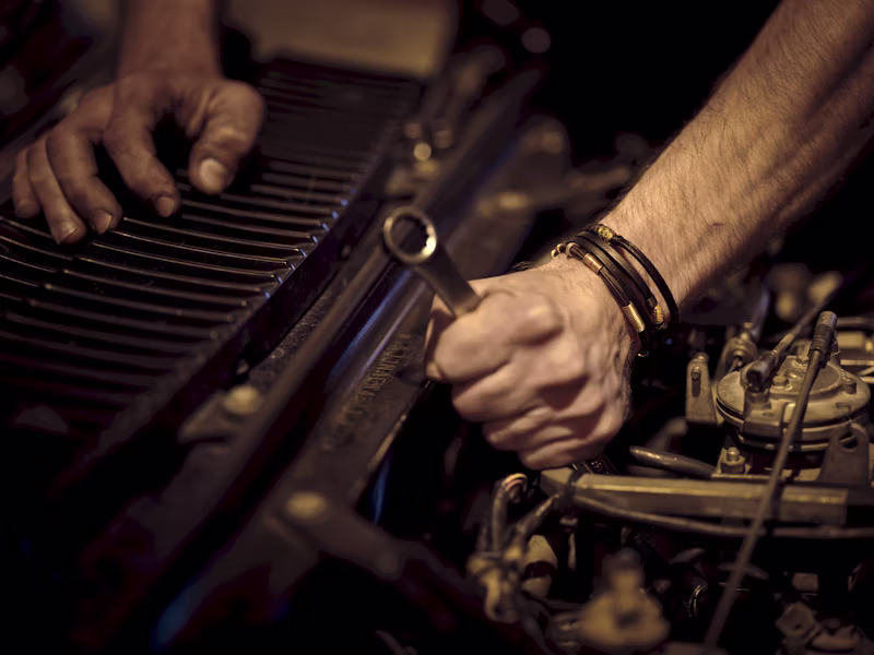 Professional mechanic working on a car engine